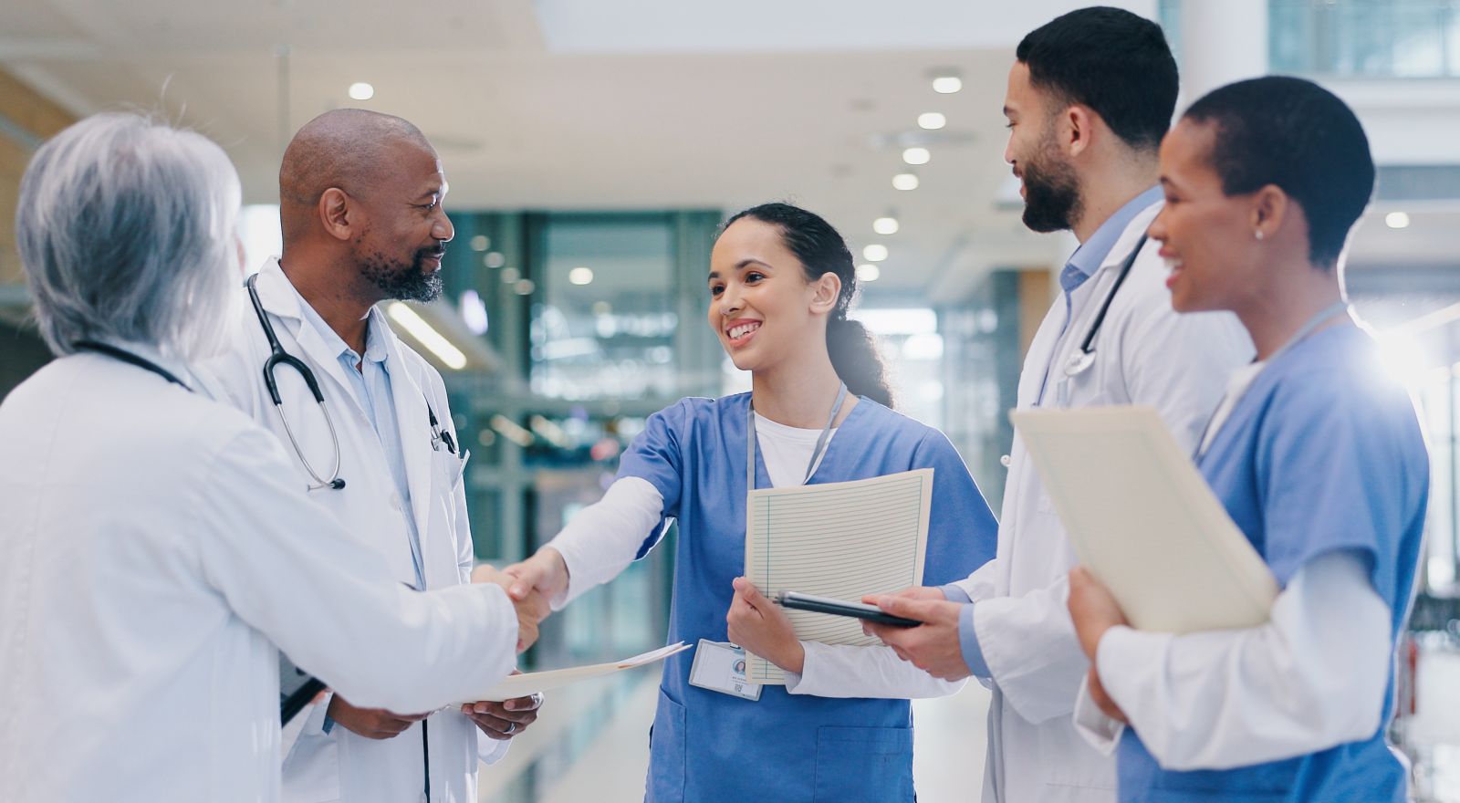A nurse and two doctors in conversation